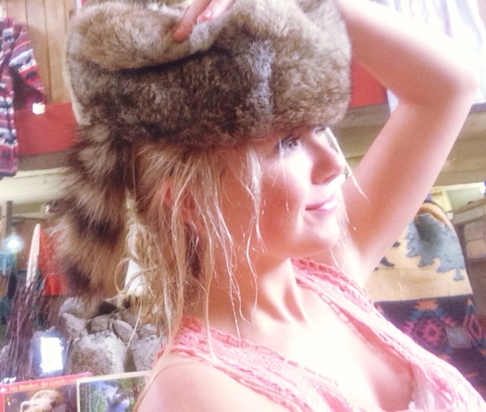 Trying on this very furry hat. Not really my style!